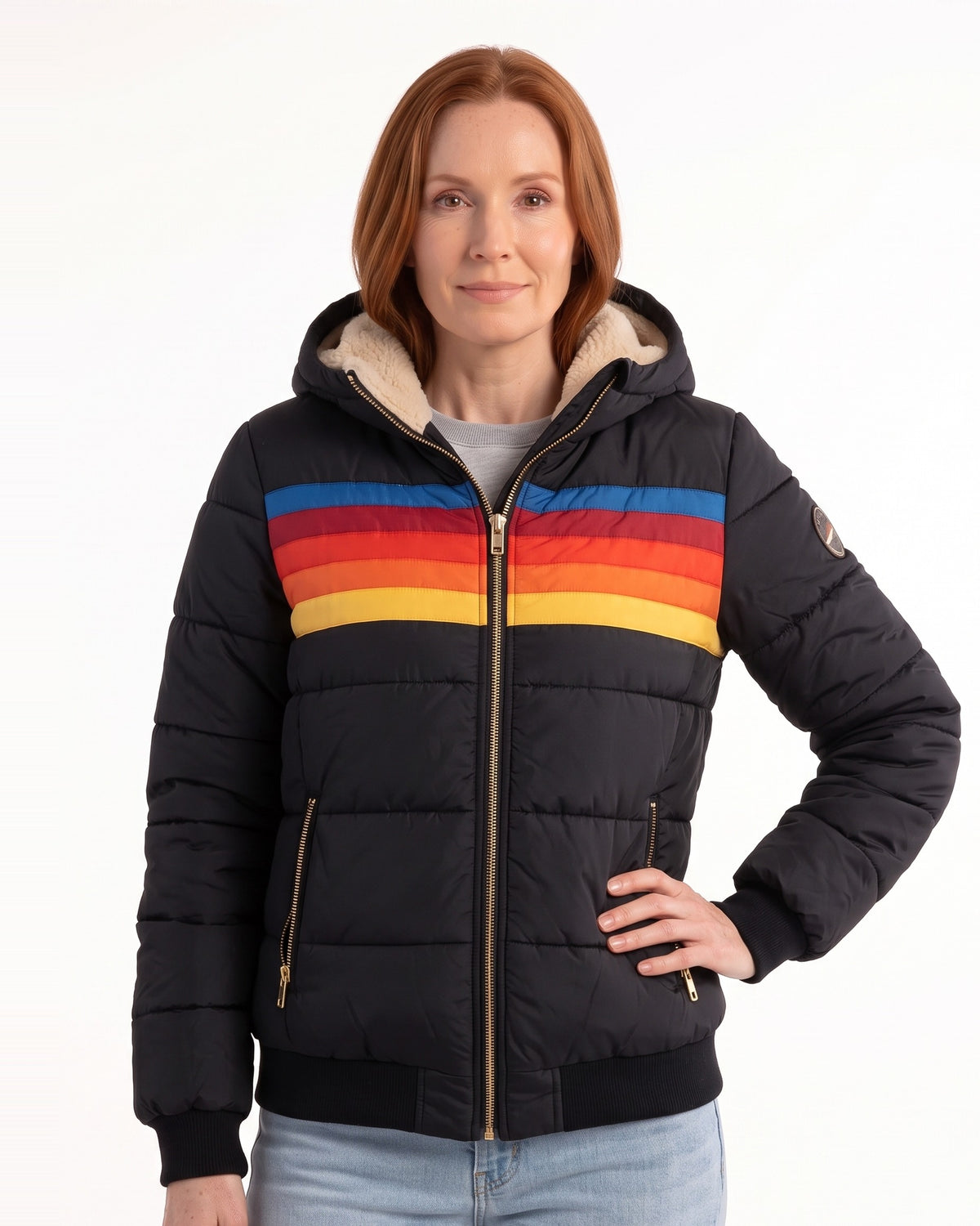 Women’s black hooded puffer jacket with sherpa-lined hood, rainbow stripe, front pockets