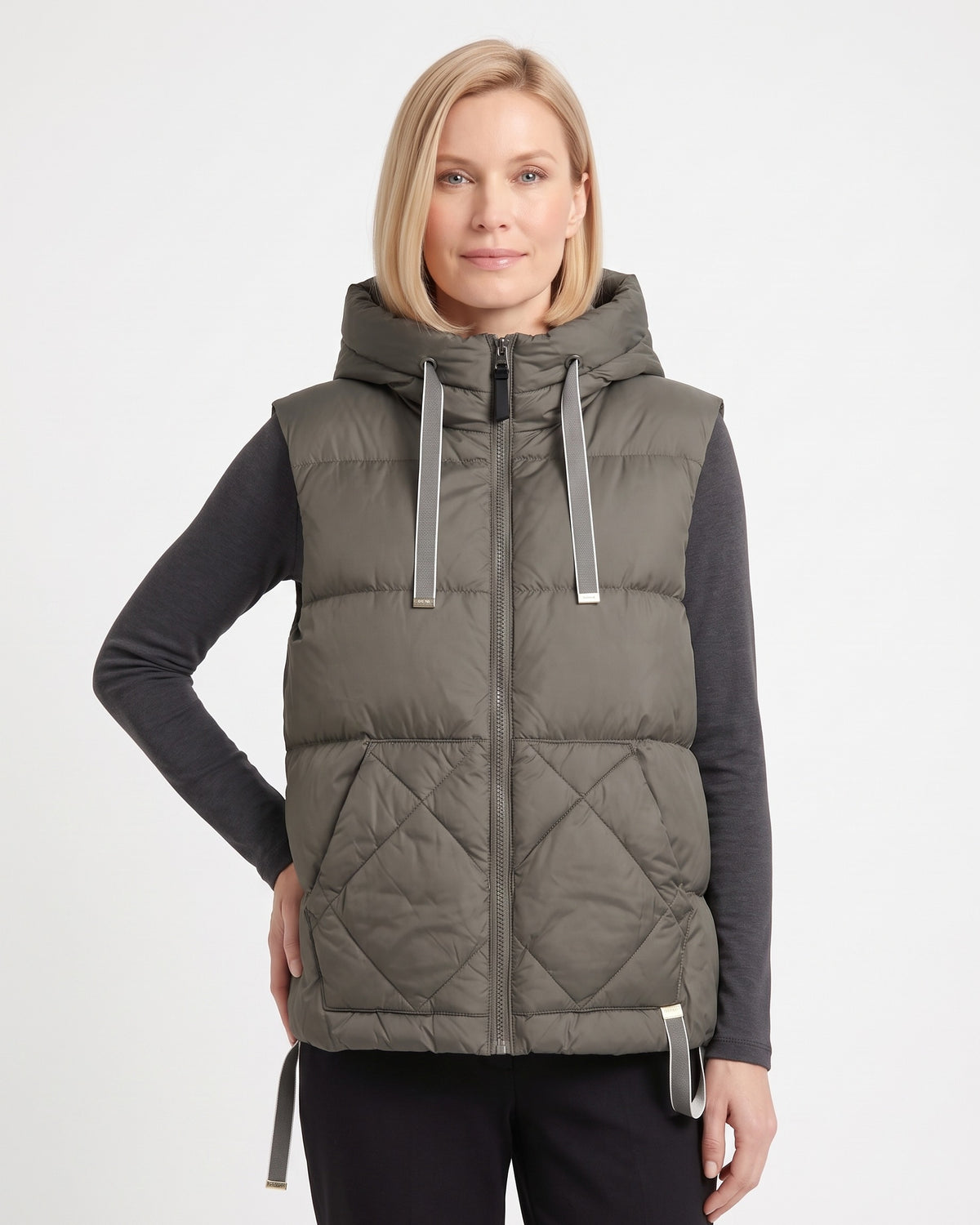 Dark green women's hooded puffer vest with diamond quilting and zip front