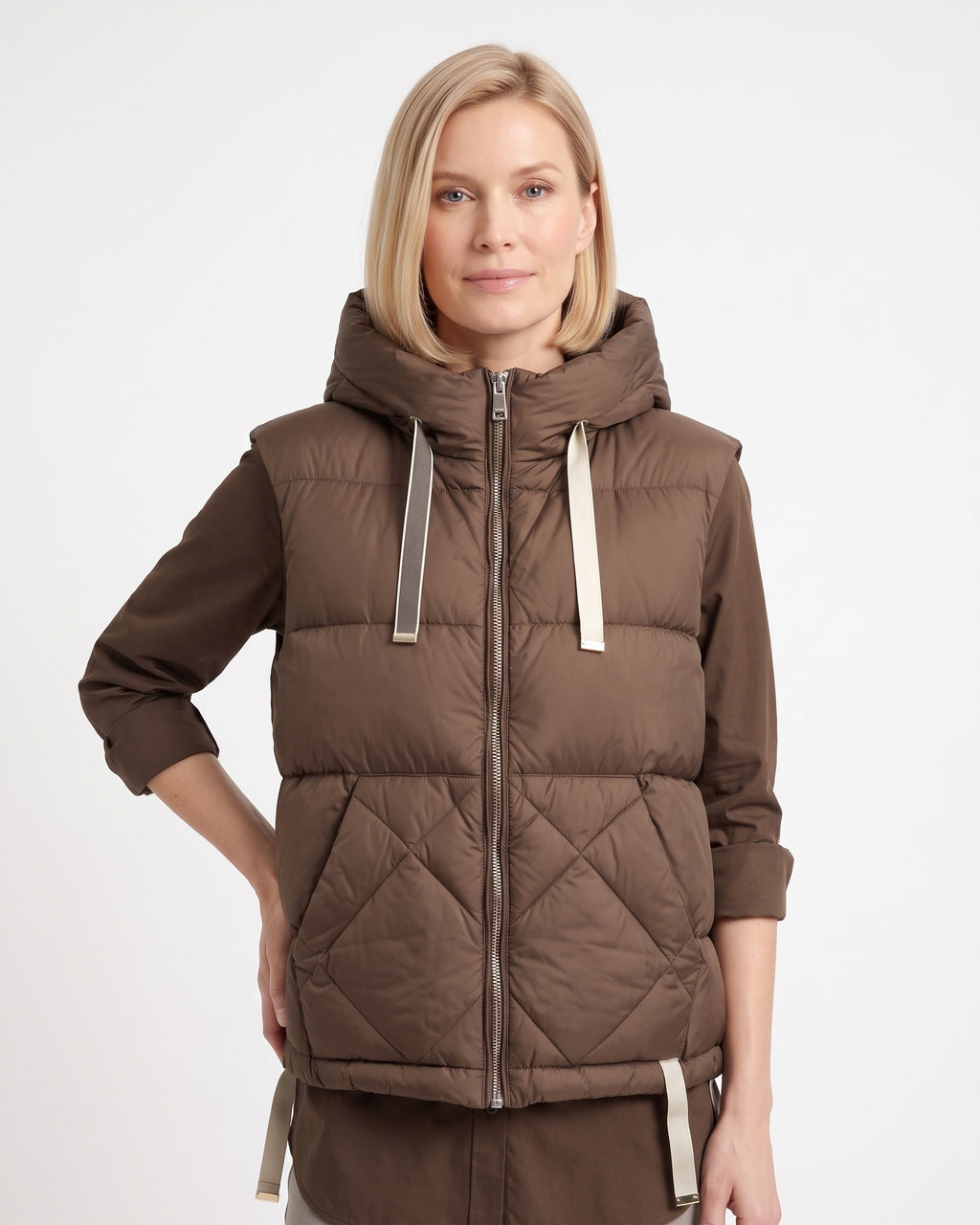 Brown women's hooded puffer vest with diamond-quilted panels and zip front