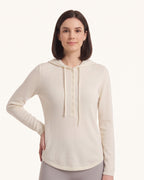 Women's off-white hooded henley sweater with button placket and drawstring hood