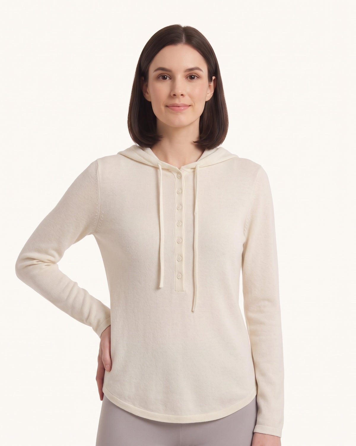 Women's off-white hooded henley sweater with button placket and drawstring hood