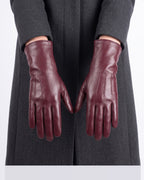 Women’s burgundy leather winter gloves, fleece-lined cuffs and five-finger design