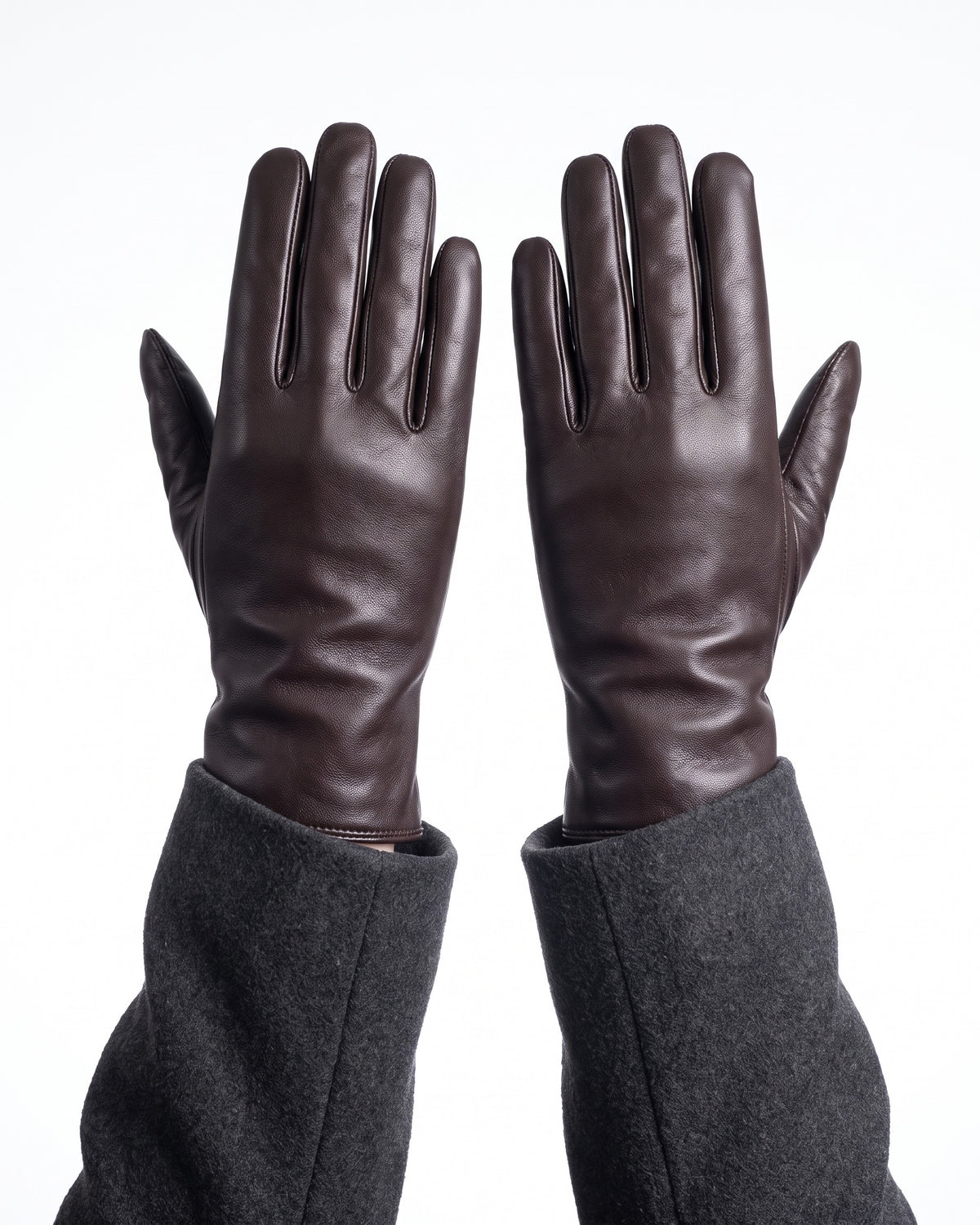 Dark brown leather winter gloves with gray fleece lining and long stitched cuffs