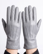 Light gray leather winter gloves with dark gray fleece lining and stitched panels