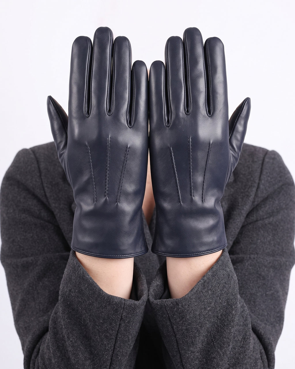 Navy blue leather gloves with straight finger seams, fleece-lined winter style.