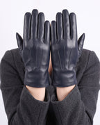 Navy blue leather gloves with straight finger seams, fleece-lined winter style.