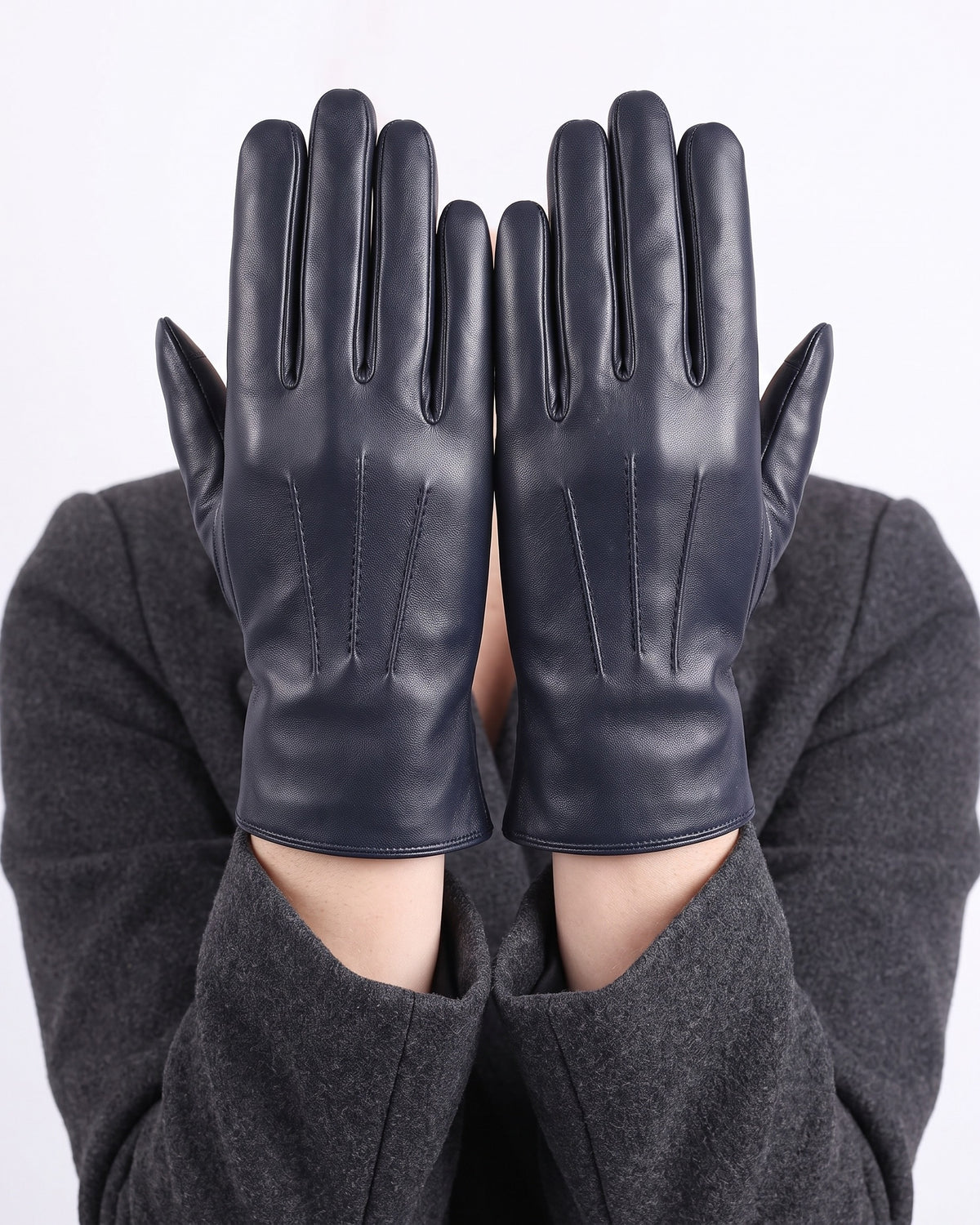Navy blue leather gloves with straight finger seams, fleece-lined winter style.