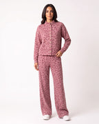 Pink leopard-print two-piece: button-front stand-collar jacket and wide-leg pants