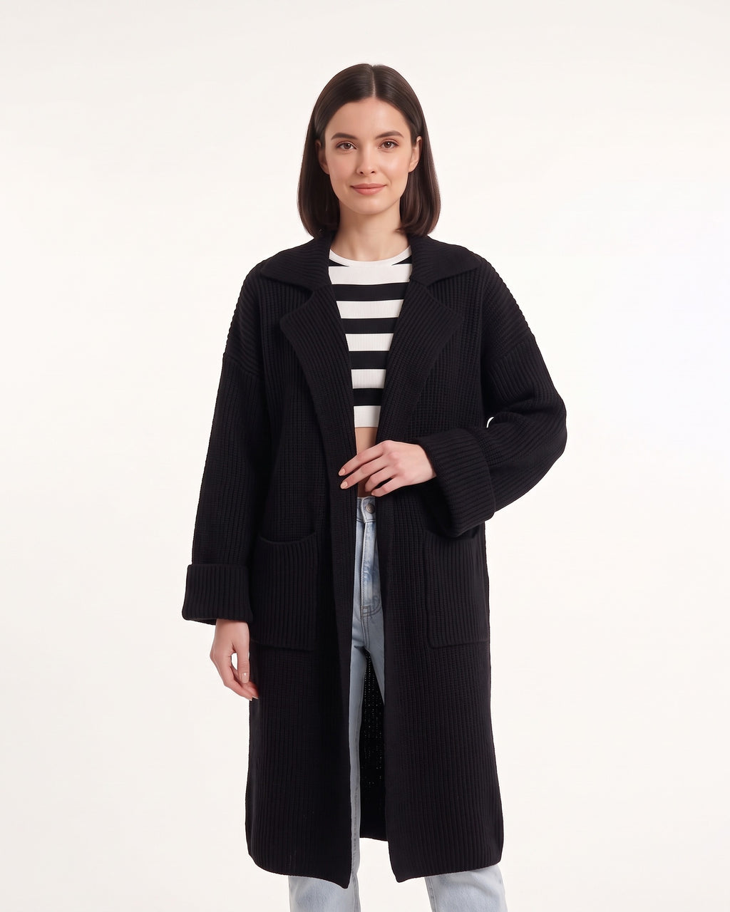 Black long duster cardigan with chunky knit texture, notched collar and side pockets