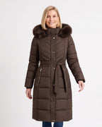 Women's long dark brown puffer coat with faux fur trimmed hood, belt, and chevron quilting