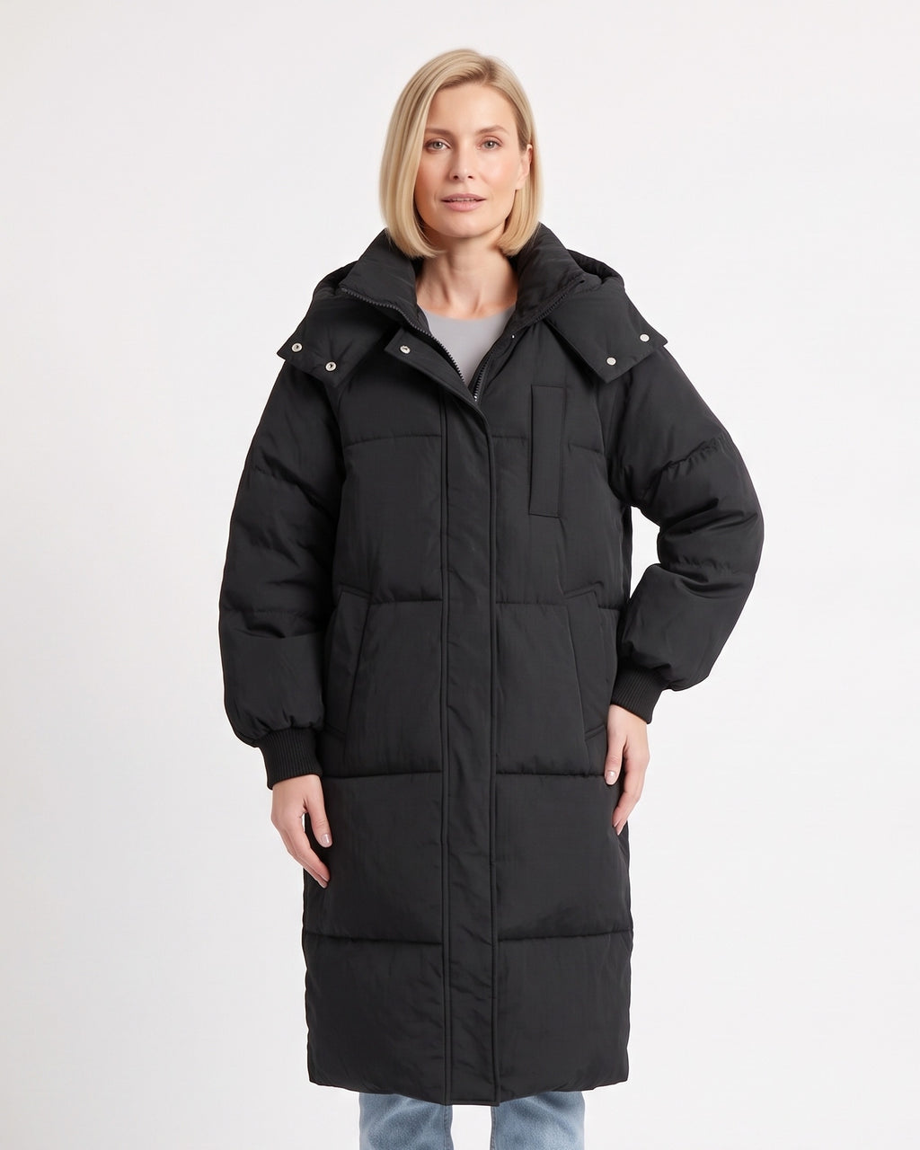 Women's long black puffer coat with hood, zip-front and quilted knee-length design
