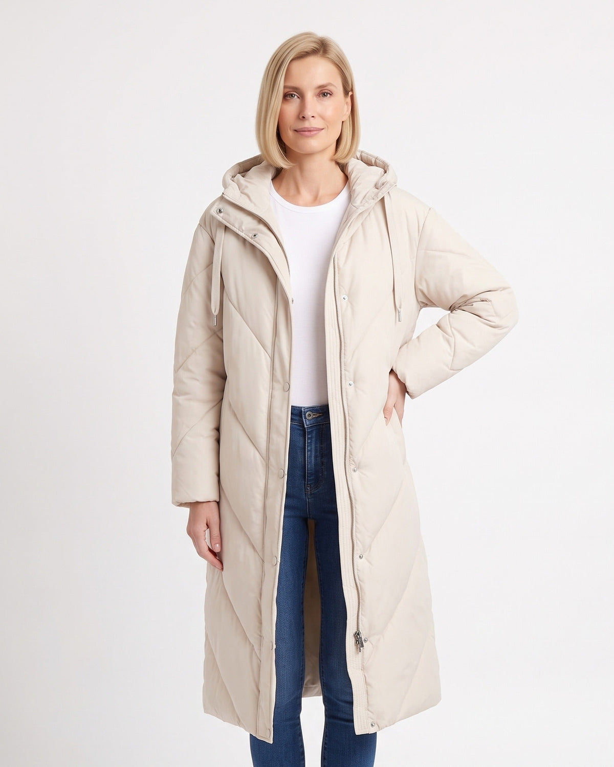 Women's cream hooded long puffer coat, chevron quilting, snap-front.