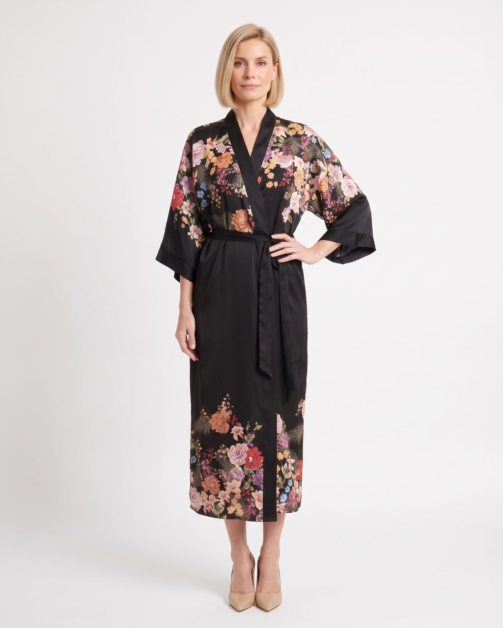 Black satin kimono robe with colorful floral print panels, V-neck, wide sleeves, tie belt.
