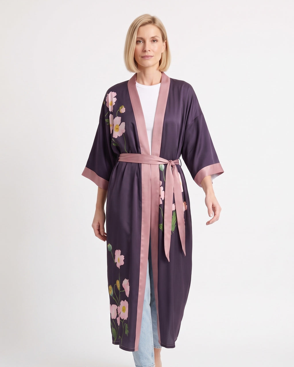 Purple satin kimono robe with scattered floral print, V-neck, wide sleeves, pink tie belt.