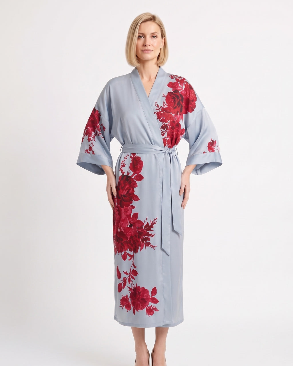 Sky blue satin kimono robe with bold red floral print, wide sleeves, and tie belt.