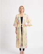 Light cream satin kimono robe with pastel floral print, open front, wide sleeves, tie belt.