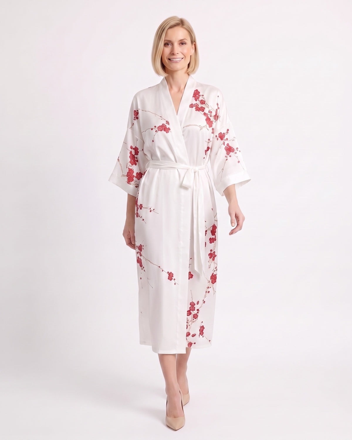 White satin kimono robe with red floral print, V-neck, wide sleeves, and tie belt.