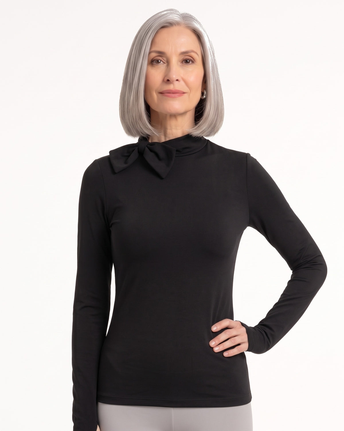 Black long-sleeve mock neck top with bow tie collar and slim fit.