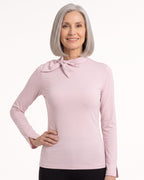 Light pink long-sleeve mock neck top with bow tie collar and slim fit.