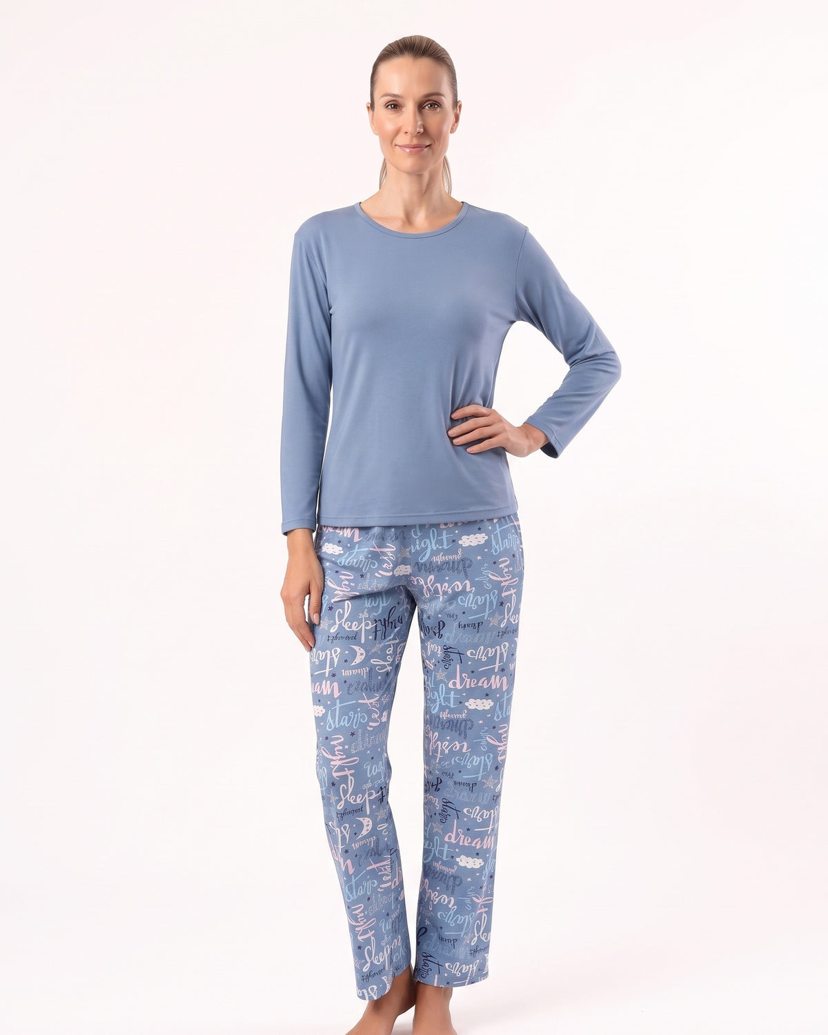 Women’s long-sleeve crew neck pajama set, blue top with printed pajama pants.