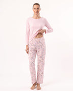 Women’s long-sleeve crew neck pajama set, light pink top with printed pajama pants.