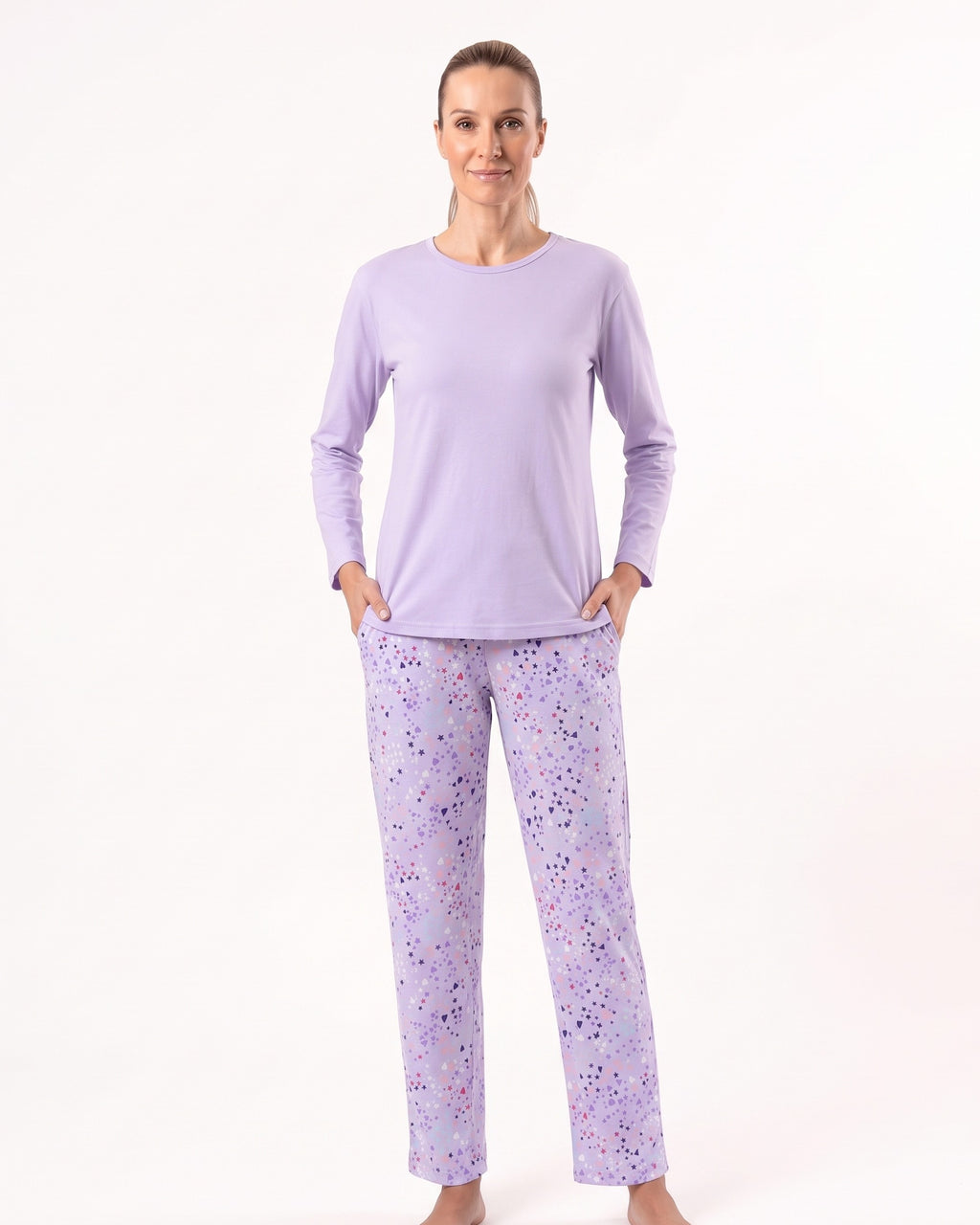 Women’s long-sleeve crew neck pajama set, light purple top with printed pajama pants.