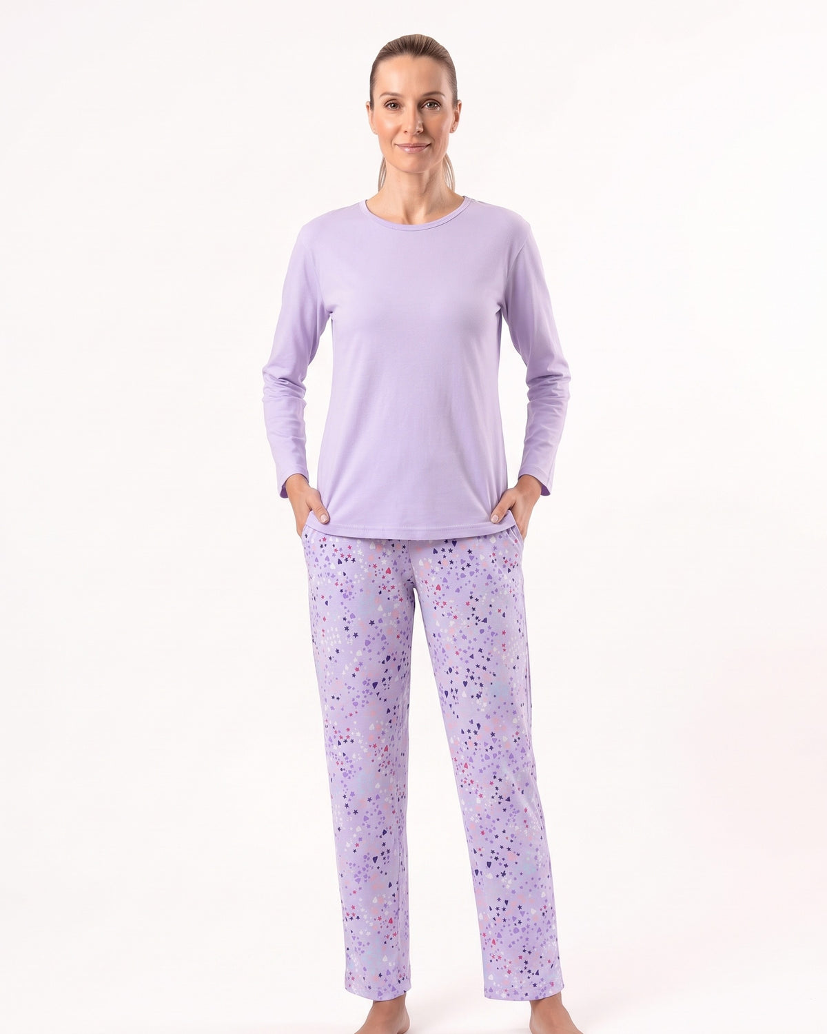 Women’s long-sleeve crew neck pajama set, light purple top with printed pajama pants.