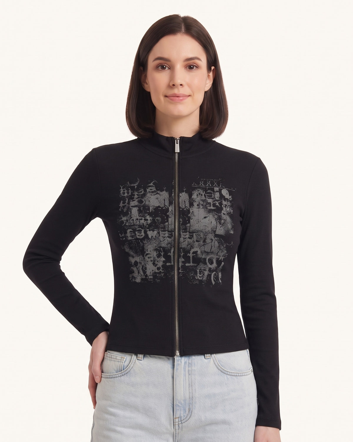 Black long-sleeve zip-up top with stand collar and distressed graphic front