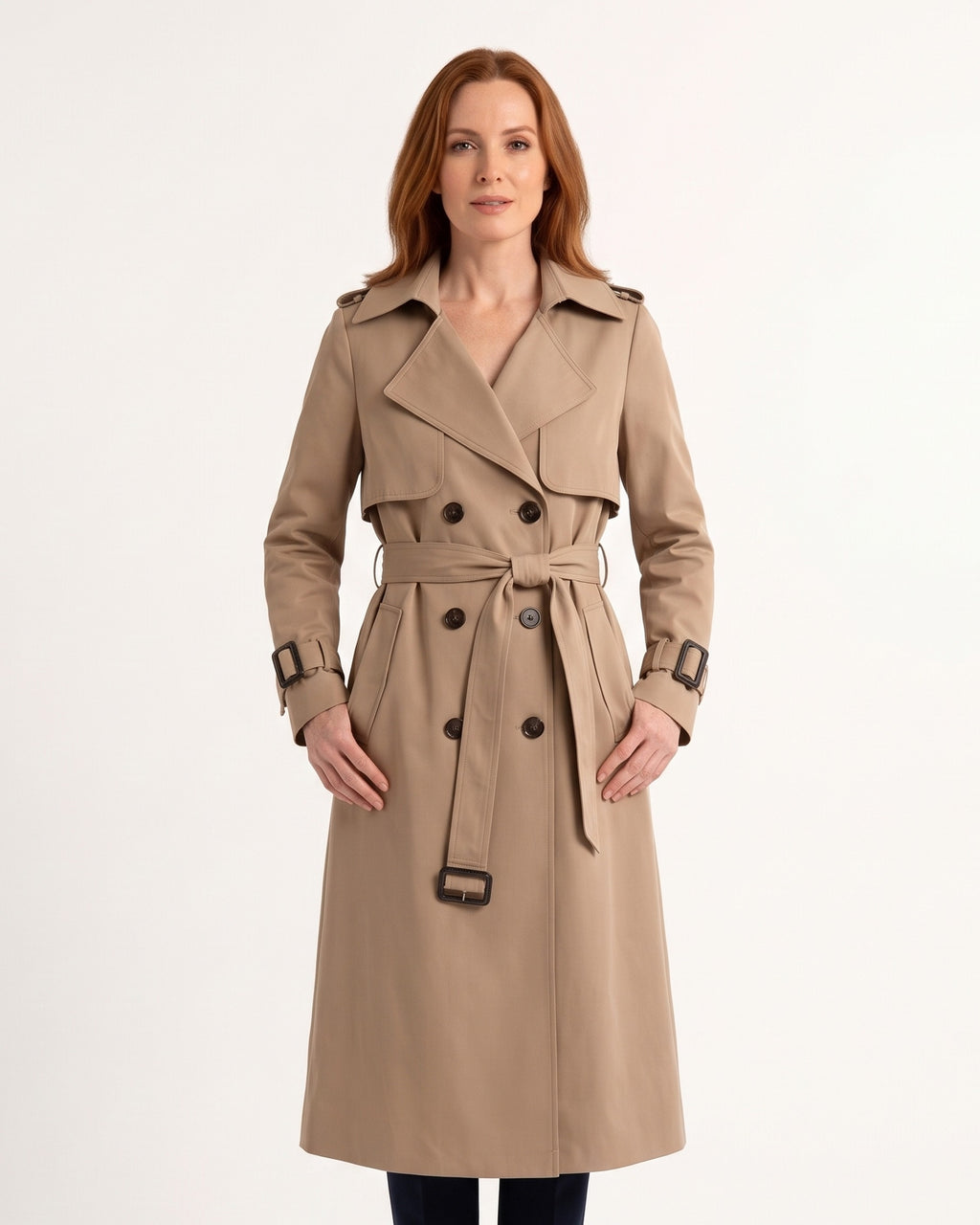 Khaki women’s trench coat with belt, double-breasted buttons, and buckle straps at cuffs