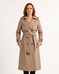 Khaki women’s trench coat with belt, double-breasted buttons, and buckle straps at cuffs