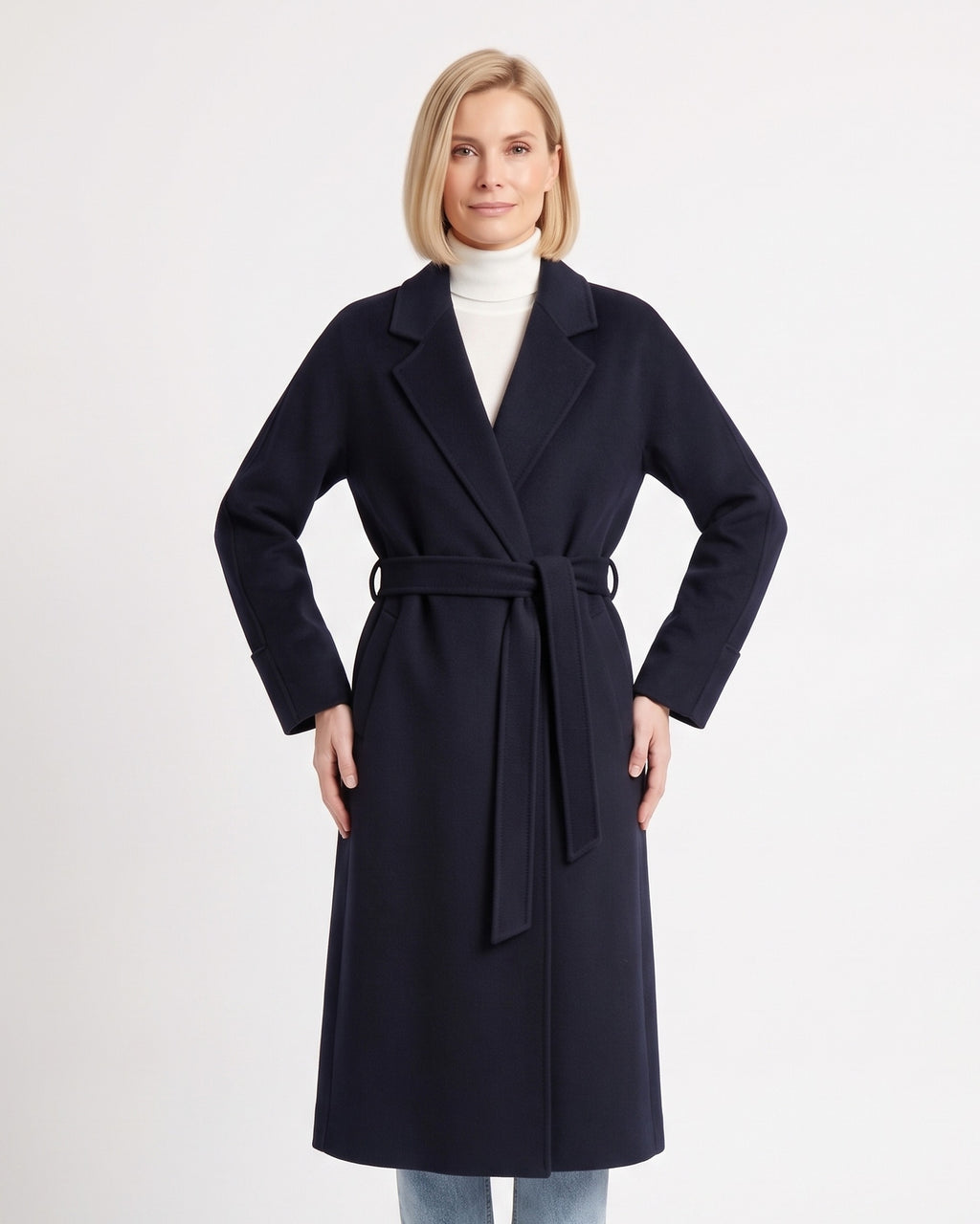 Women’s navy wrap coat with tie belt, notch lapels, and long sleeves