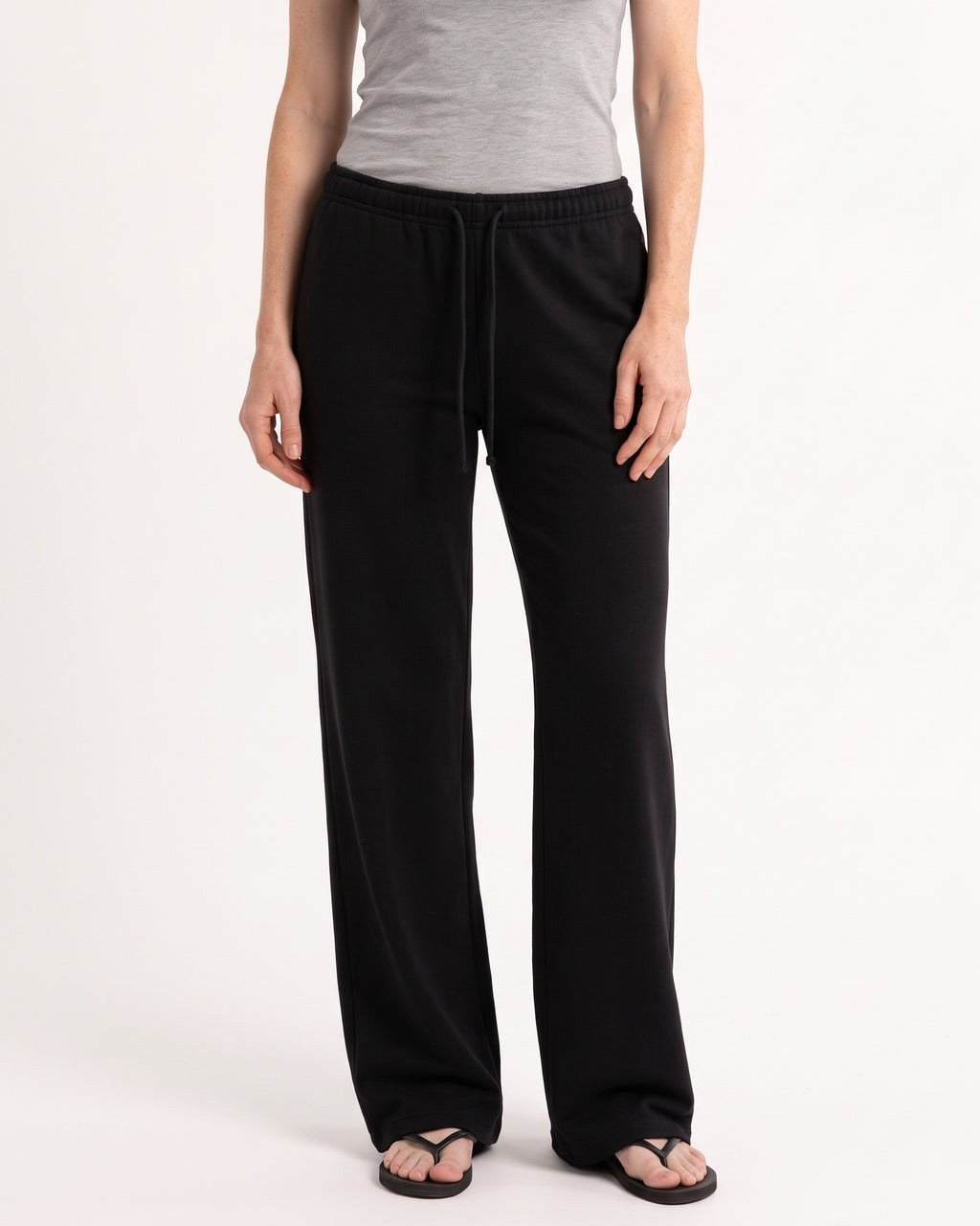 Black low-rise wide-leg sweatpants with drawstring waist and side pockets