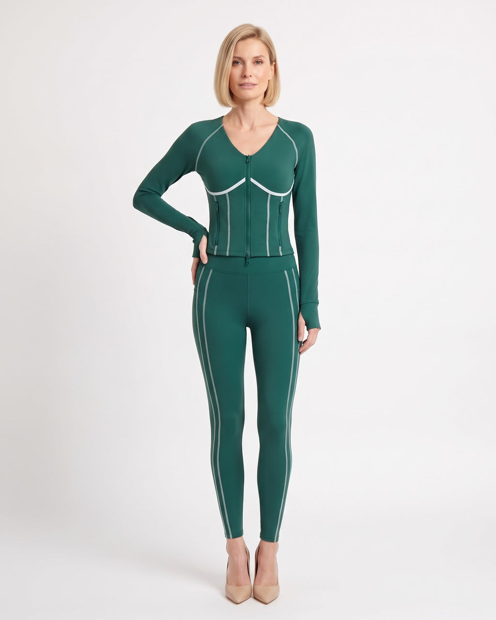 Dark green workout set with zip jacket and high-waist leggings, contrast piping