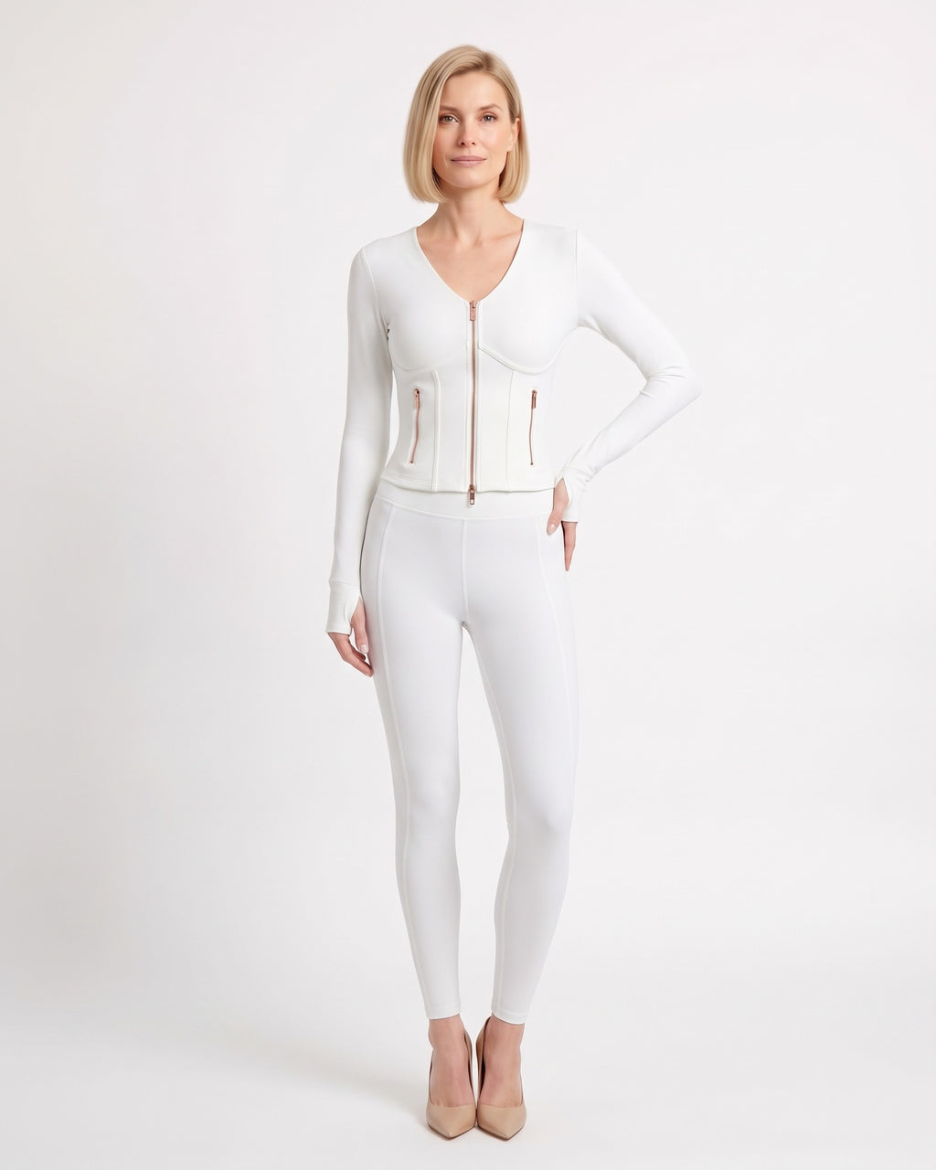 White workout set with cropped zip jacket and fitted high-waist leggings