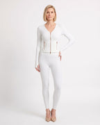 White workout set with cropped zip jacket and fitted high-waist leggings
