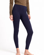 Women's navy merino wool thermal leggings, full-length with fitted stretch waistband.
