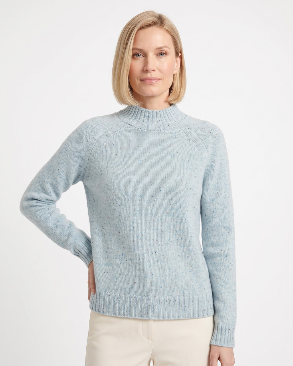 Women’s light blue speckled mock neck sweater with ribbed hem and long raglan sleeves