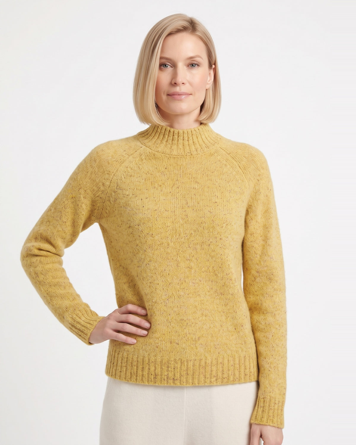 Women’s mustard yellow speckled mock neck sweater with ribbed collar and cuffs