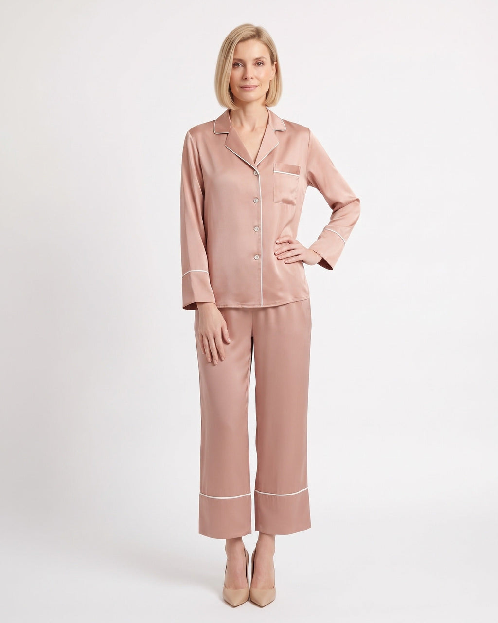 Pink silk pajama set with notch-collar button top and cropped wide-leg pants with piping
