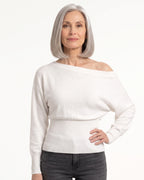 White off-shoulder cropped knit sweater with long batwing sleeves and ribbed waist detail
