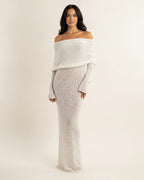 Off-shoulder knit maxi dress, long sleeves, column silhouette, light off-white.