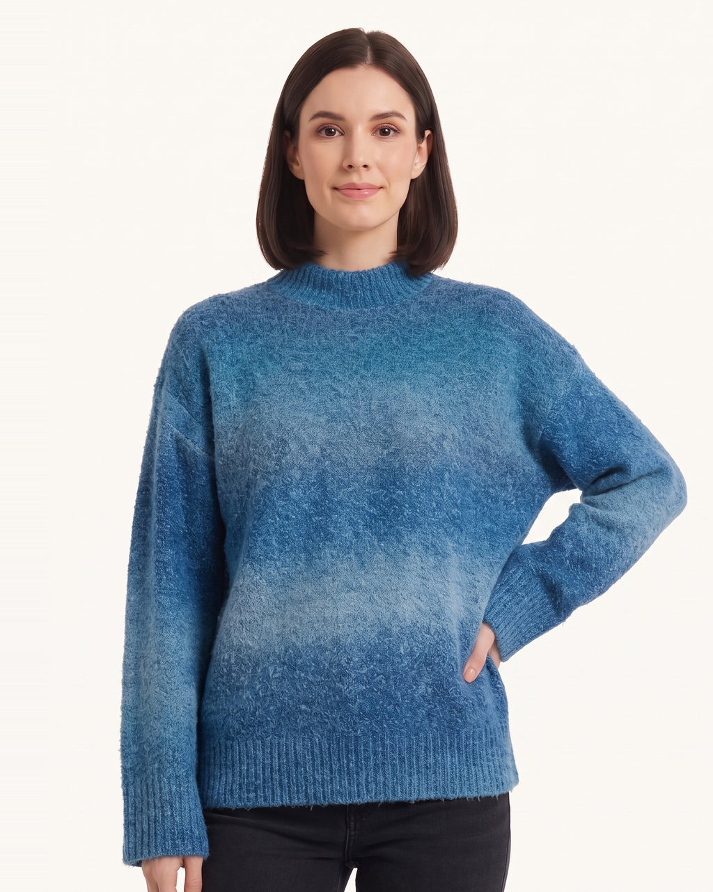 Women’s oversized mock neck gradient knit sweater in blue ombre with ribbed hem.