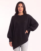 Women's oversized batwing crewneck sweater, black knit with ribbed cuffs and asymmetric hem