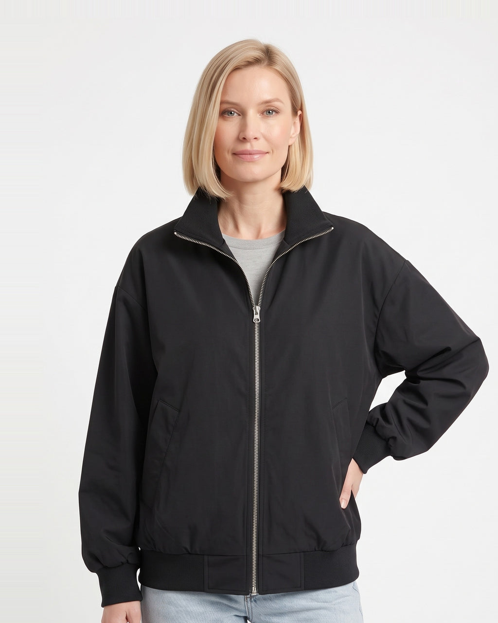 Black oversized cotton twill bomber jacket with stand collar and zip front, ribbed cuffs