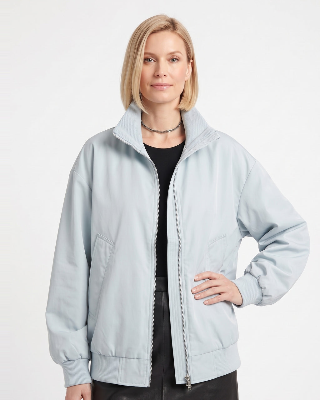 Light blue oversized cotton twill bomber jacket with stand collar zip front and side pockets