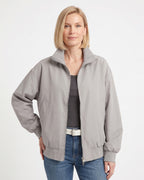 Light gray oversized cotton twill bomber jacket with stand collar, zip front, side pockets