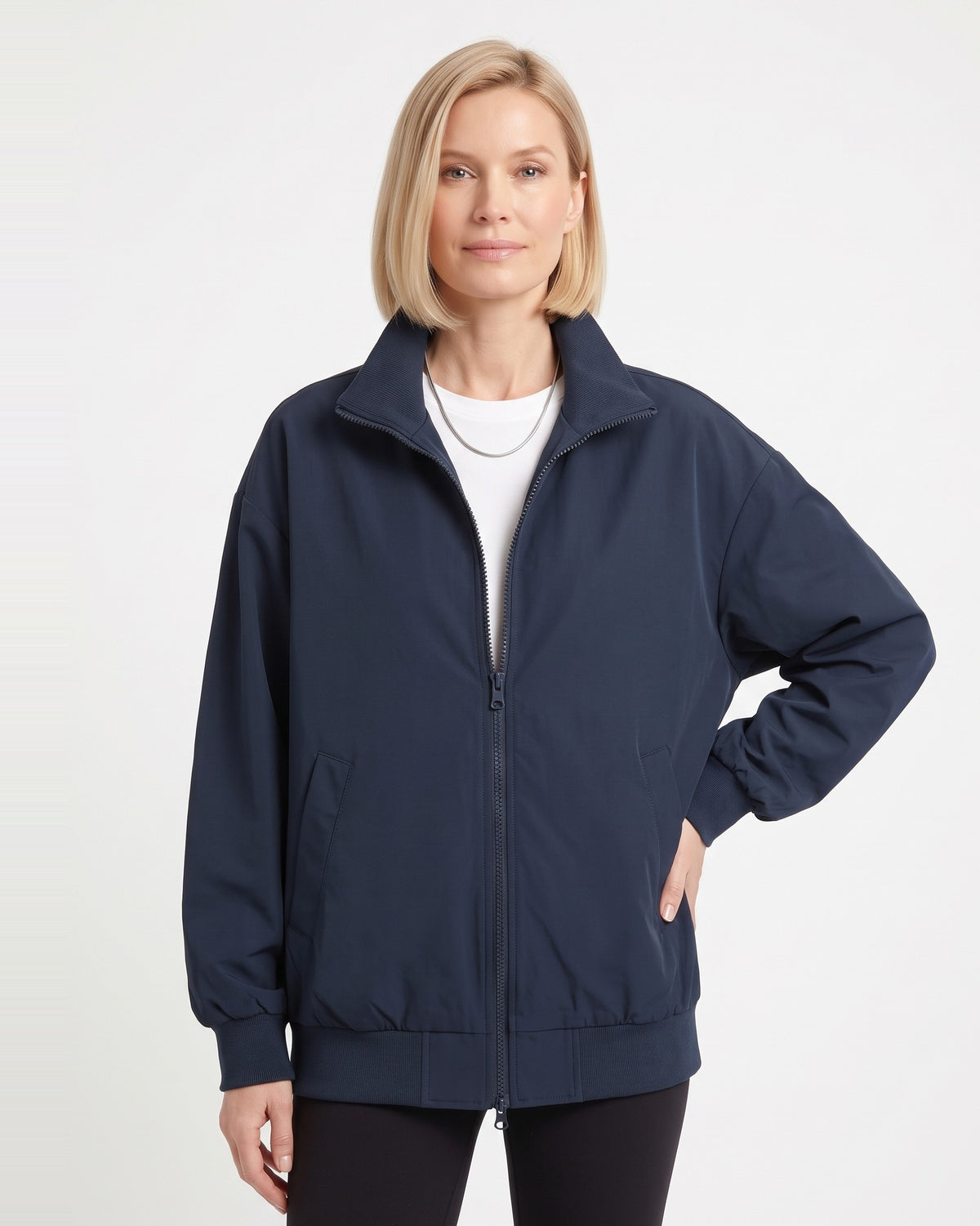 Navy blue oversized cotton twill bomber jacket with stand collar zip front and ribbed hem