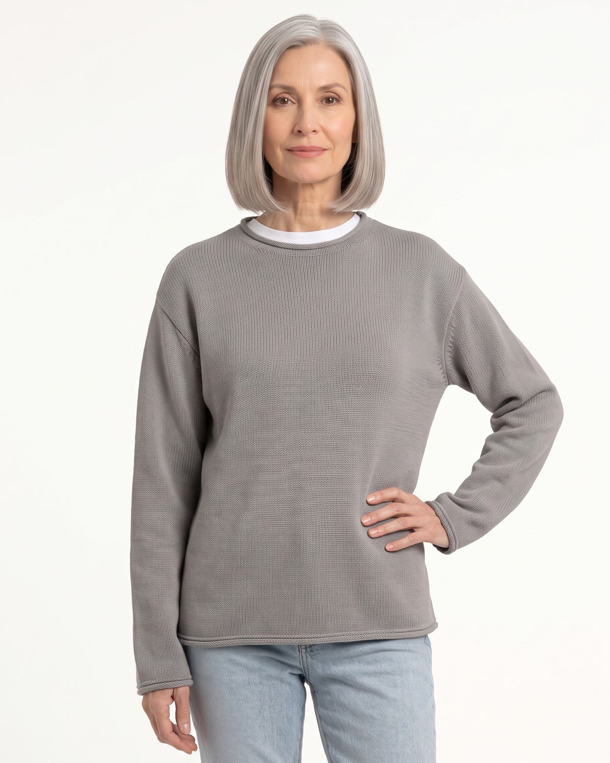 Light gray oversized cotton sweater with rolled crew neck, drop shoulders, and long sleeves