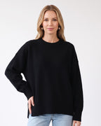 Black oversized crew neck knit sweater with ribbed cuffs and ribbed hem