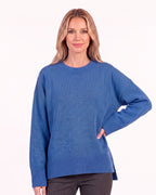 Blue oversized crew neck knit sweater with ribbed cuffs and ribbed hem
